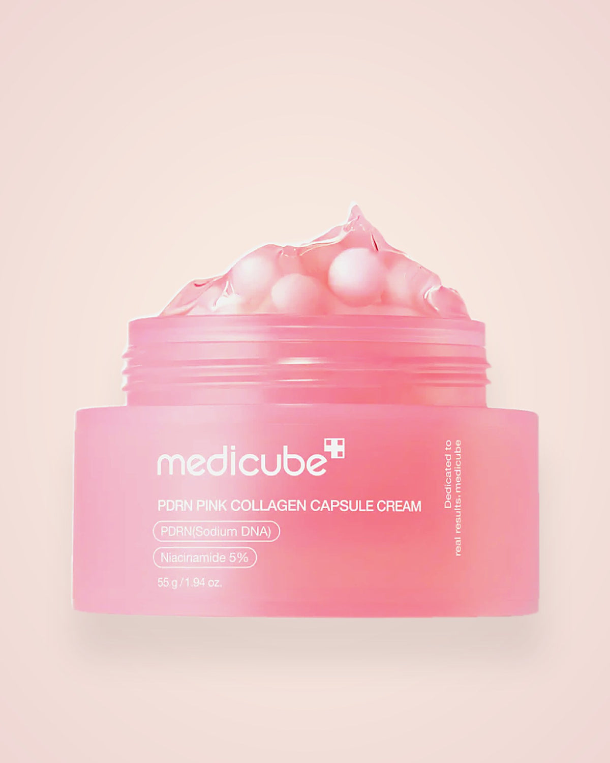Frasco de Medicube PDRN Pink Collagen Capsule Cream de 55 g sobre fondo crema